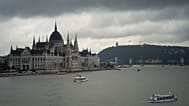 FILE - Dark clouds are seen over the Parliament building in Budapest, Hungary, during the flooding of the Danube river. 16 September 2024. 