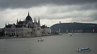 FILE - Dark clouds are seen over the Parliament building in Budapest, Hungary, during the flooding of the Danube river. 16 September 2024. 