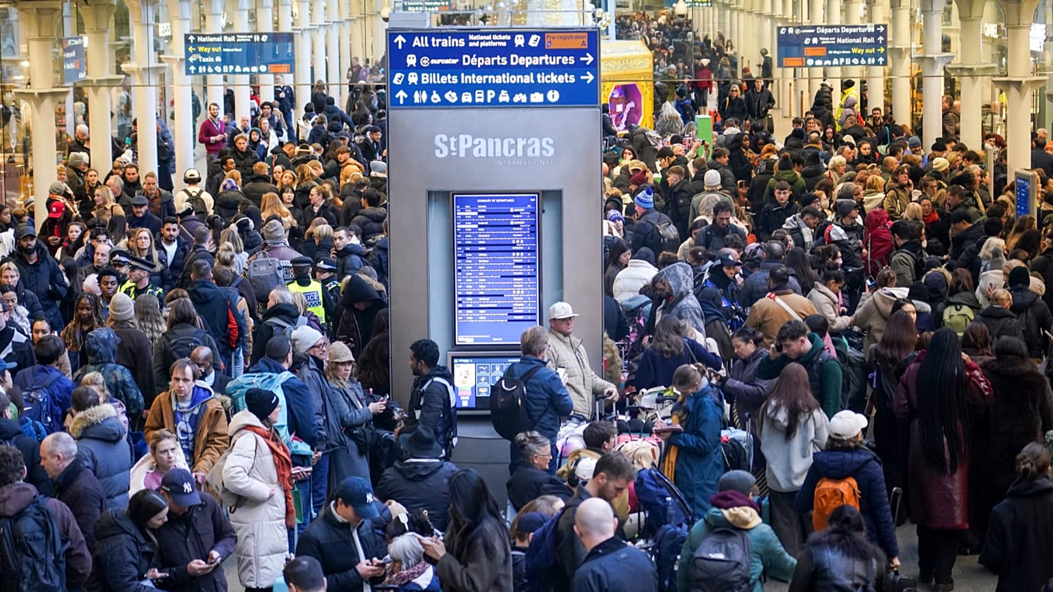 Travellers queue for Eurostar services at St Pancras International station in London, Tuesday, Dec. 30, 2025.