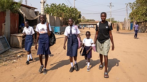 Schoolgirls walk back home after being turned away from their school due to an ongoing extreme heatwave that has caused some students to collapse in Juba, South Sudan.