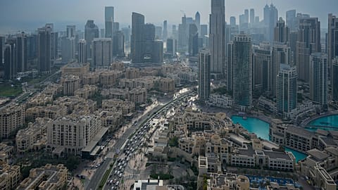 Vehicles drive through Dubai, 31 December, 2024