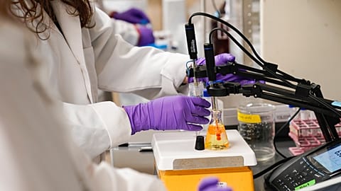 A water researcher tests a sample of water for PFAS, Tuesday, Feb. 14, 2023.