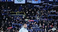 Fans hold up scarves to support their teams prior to the Champions League opening phase match between Club Brugge and Arsenal in Bruges, 10 December, 2025