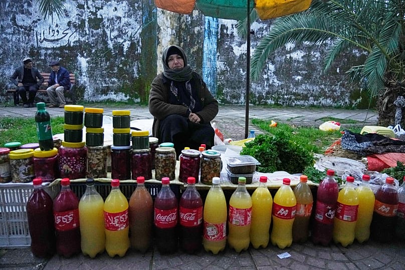 A vendor waits for customers at a traditional street market in the port city of Bandar Anzali, 25 December, 2025