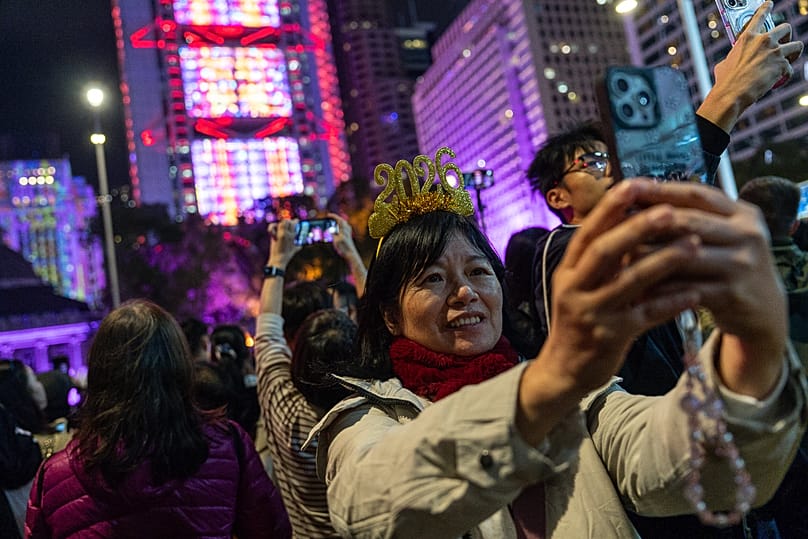 People take selfies during the New Year countdown event to celebrate the start of 2026 in the Central district of Hong Kong, 1 January, 2026