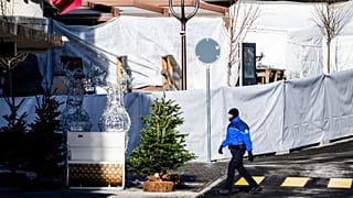 Police officers inspect the area where a fire broke out at the bar and lounge during New Year’s celebration, in Crans-Montana, Swiss Alps, 1 January 2026