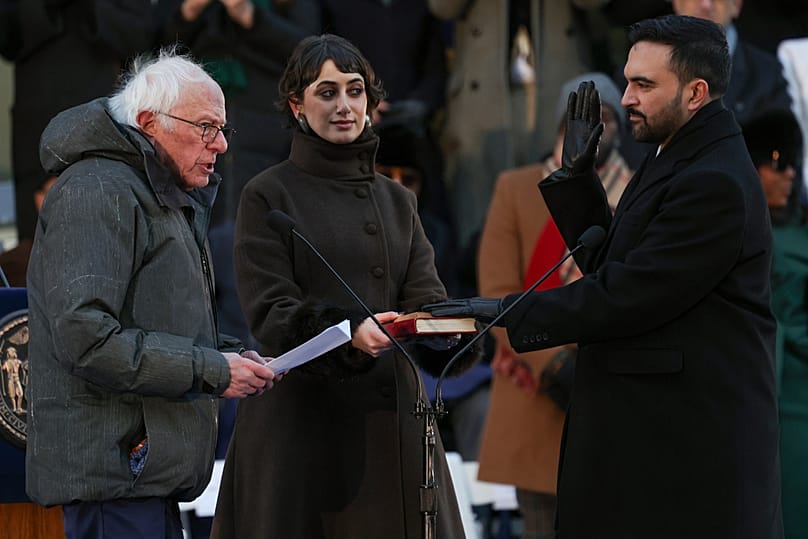 Senator Bernie Sanders administers the oath of office to Mayor Zohran Mamdani as wife Rama Duwaji holds the Quran during inauguration ceremony, Thursday, Jan. 1, 2026, in NYC