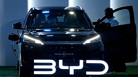 FILE - Journalists inspect a BYD Atto 3 displayed during its launch event in Jakarta, Indonesia. 18 January 2024. 