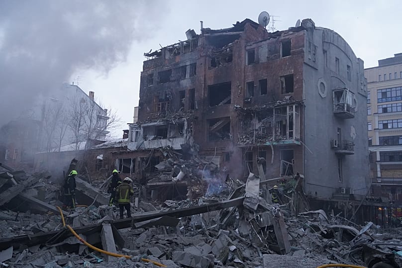 Emergency services personnel work to extinguish a fire following a Russian missile attack in Kharkiv, 2 January, 2026