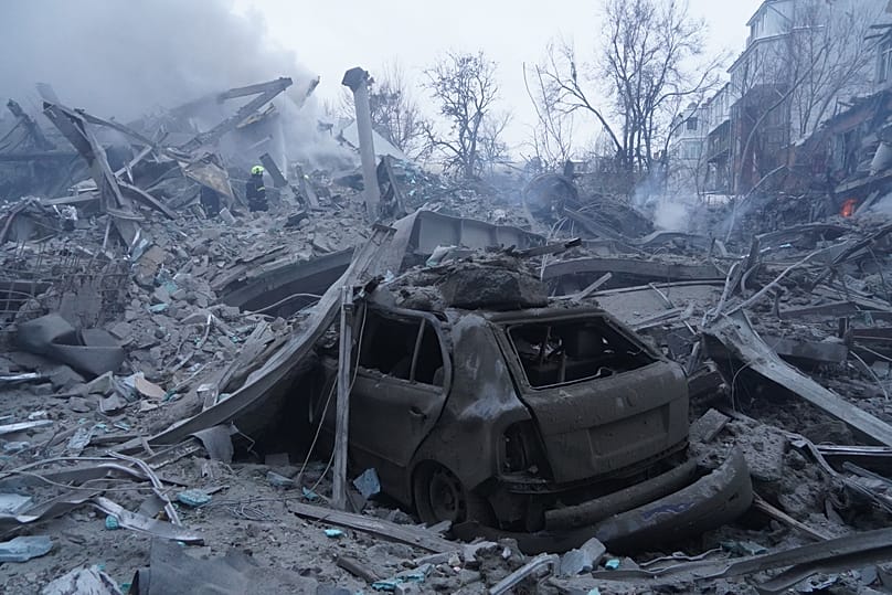 Emergency services personnel work to extinguish a fire following a Russian missile attack in Kharkiv, 2 January, 2026