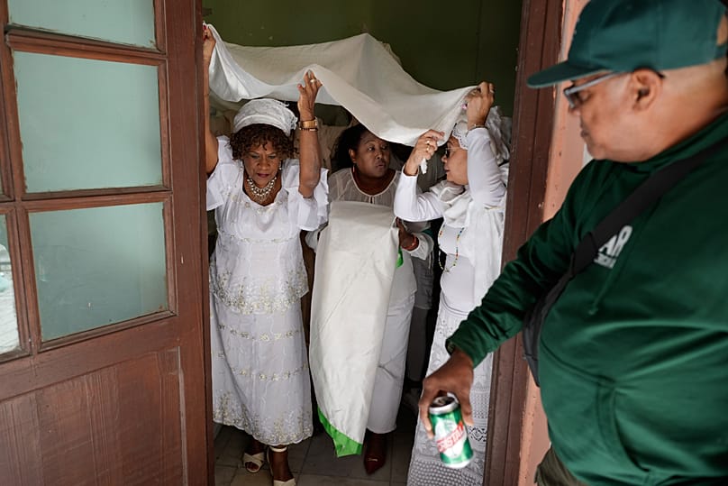 Santería followers prepare to perform a holy drum beat after the reading of the Letter of the Year in Havana, Cuba, 2 January 2026