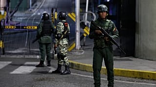 Soldiers guard the area around the Miraflores presidential palace after explosions and low-flying aircraft were heard in Caracas, 3 January 2026