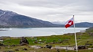 FILE: A view of a Greenland flag in the village of Igaliku in Greenland, 4 July 2025