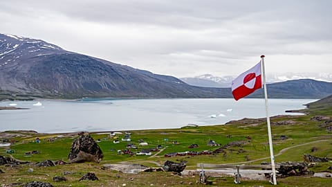 FILE: A view of a Greenland flag in the village of Igaliku in Greenland, 4 July 2025