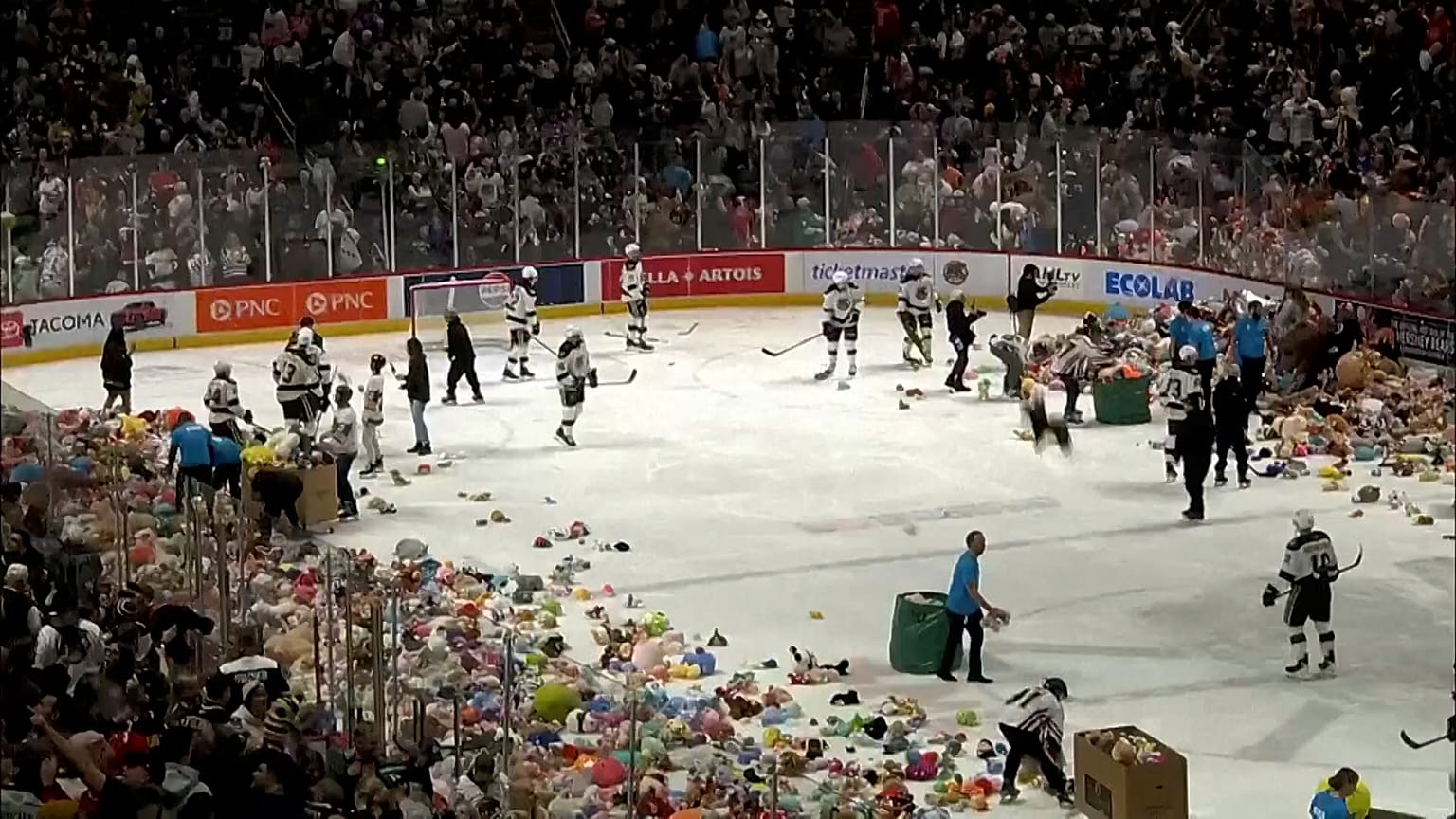 Fans tossing stuffed toys into the rink