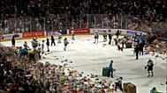 Fans tossing stuffed toys into the rink