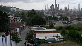 The El Palito refinery rises above Puerto Cabello, Venezuela, Sunday, Dec. 21, 2025. (AP Photo/Matias Delacroix)