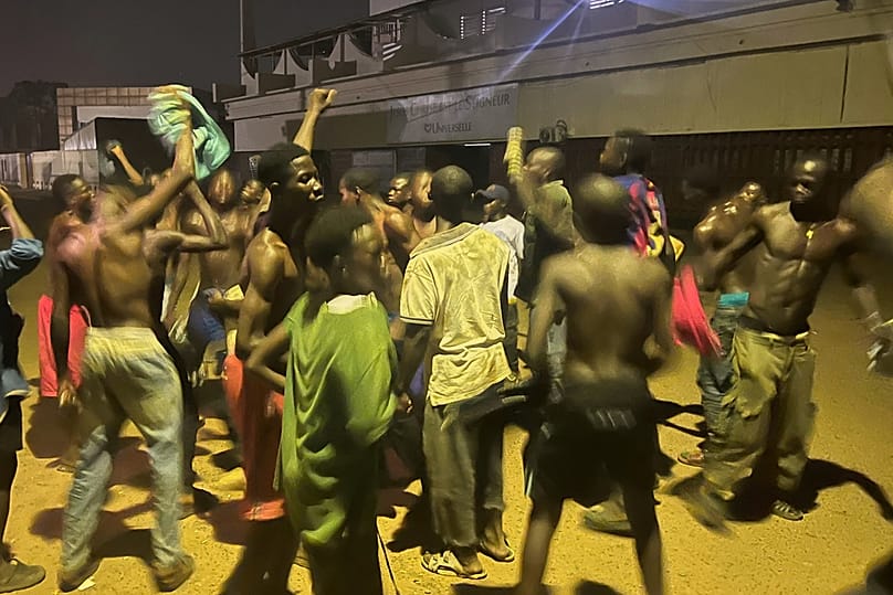 People celebrate on a street after President Faustin Archange Touadéra was declared winner of the presidential election in Bangui, Central African Republic, Jan. 5 2026