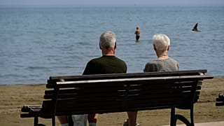 A couple of tourists enjoy the sun and the sea in southern Cyprus. 
