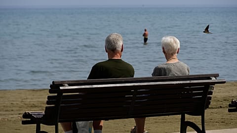 A couple of tourists enjoy the sun and the sea in southern Cyprus. 