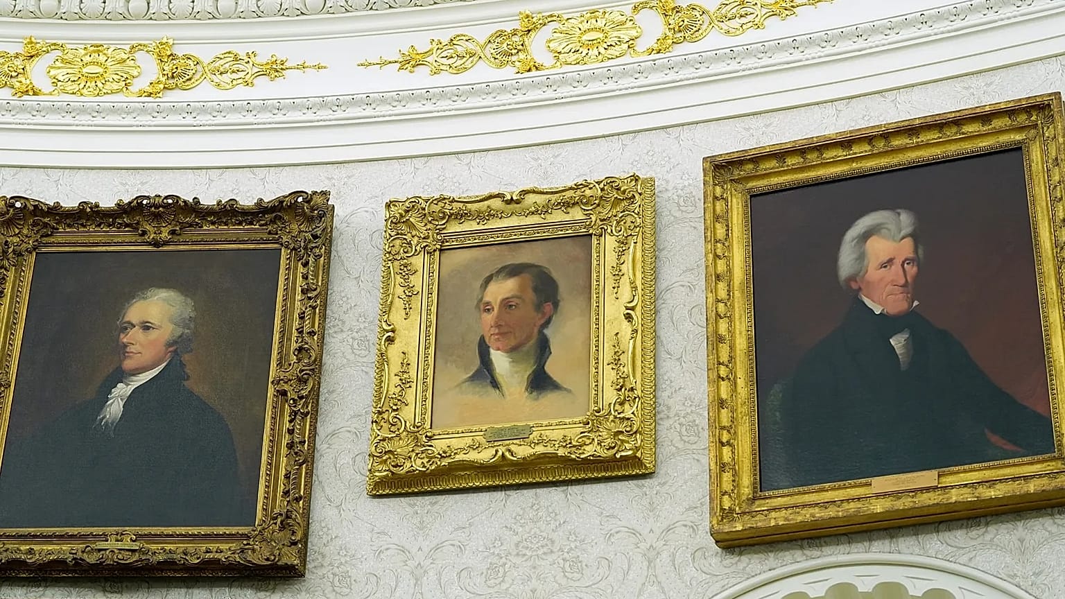 A portrait of President James Monroe, centre, hangs between paintings of Alexander Hamilton and Andrew Jackson at the White House.
