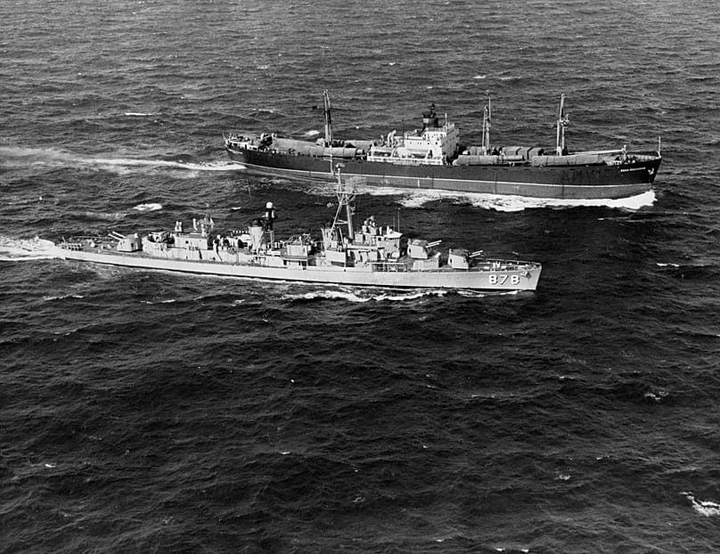 The USS Vesole, foreground, a radar picket ship, steams alongside the Soviet freighter Polzunov, outbound from Cuba, in the Atlantic Ocean, November 1962.