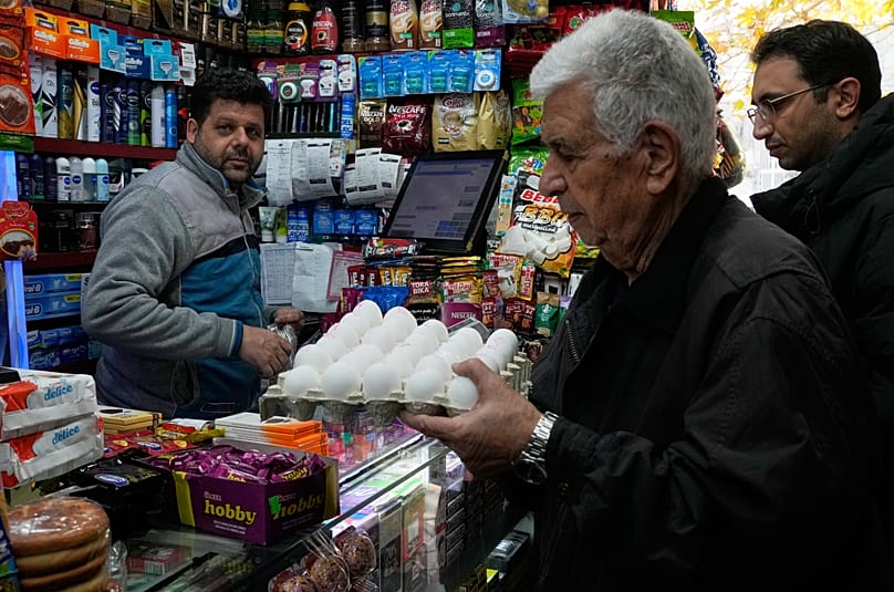 A man shops for eggs at a grocery store in northern Tehran, 6 January, 2026