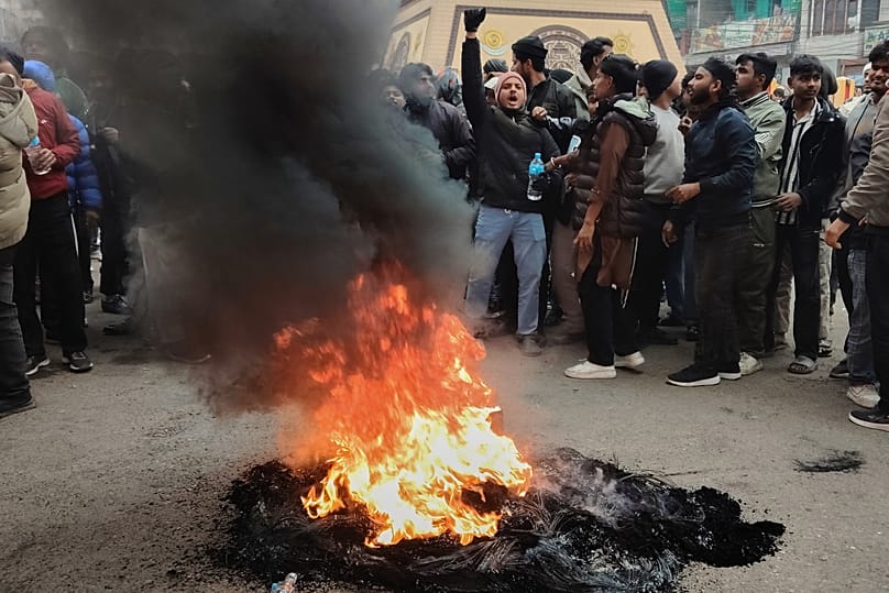 Protesters shout slogans and burn tyres as they block the main street in Birgunj, 4 January, 2026