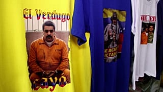 Venezuelan migrants in Peru sell T shirts of captured President Maduro