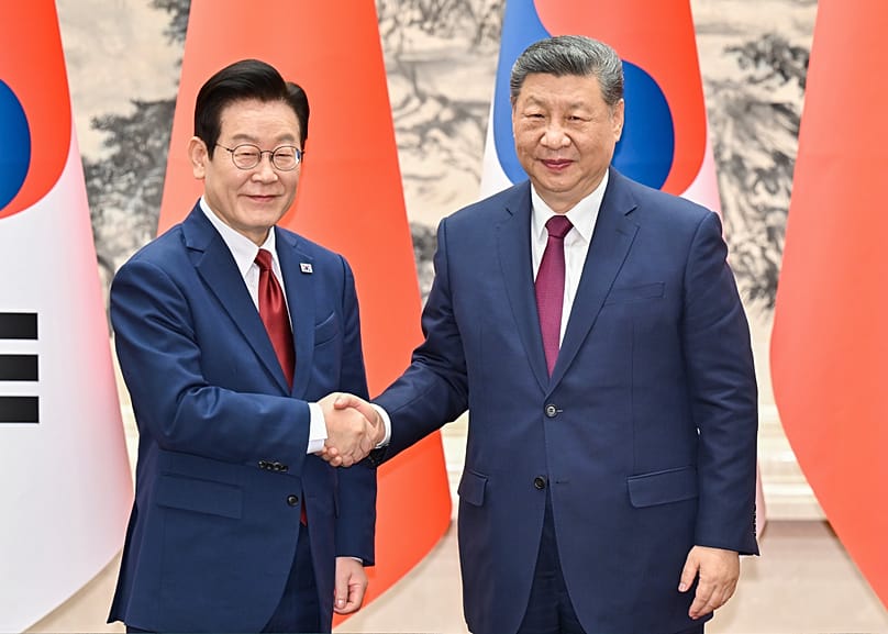 South Korean President Lee Jae Myung shakes hands with Chinese President Xi Jinping at the Great Hall of the People in Beijing, 5 January, 2026
