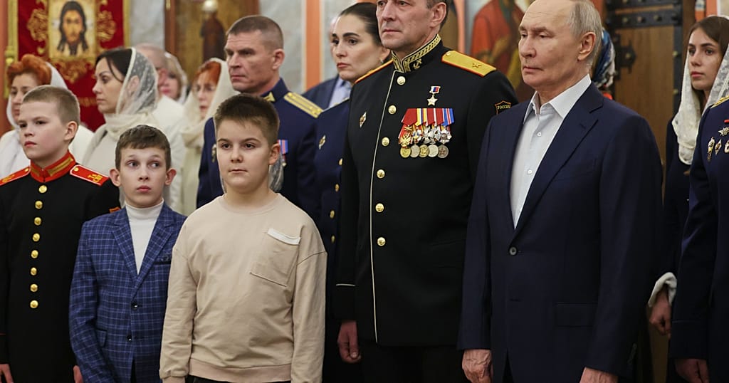 Putin attends Christmas Eve service with veterans of Ukraine war Putin attends Christmas Eve service with veterans of Ukraine war
