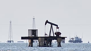 An oil pump jack stands unused in Cabimas, 7 January 2026