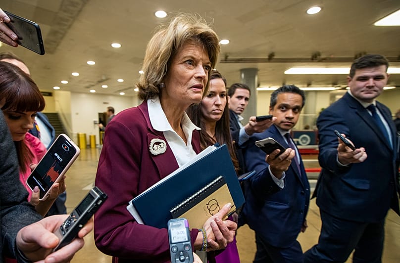 Senator Lisa Murkowski talks to reporters as she leaves the Capitol in Washington. (AP Photo/Manuel Balce Ceneta)