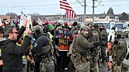 Protesters gather outside the Bishop Henry Whipple Federal Building in Minneapolis, 8 January, 2026
