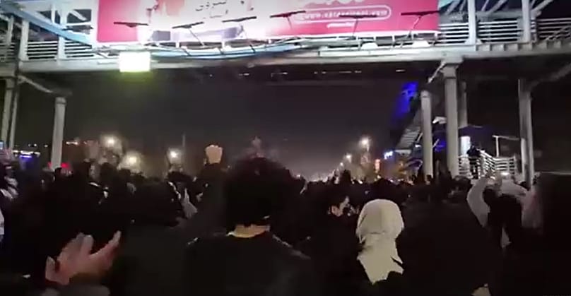 Protesters march on a bridge in Tehran, 29 December, 2025