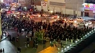 In this frame grab from video protesters block an intersection in Tehran, 8 January, 2026