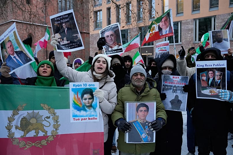 Protesters showing pictured of Crown Prince Reza Pahlavi at a demonstration in Berlin, 9 January, 2026