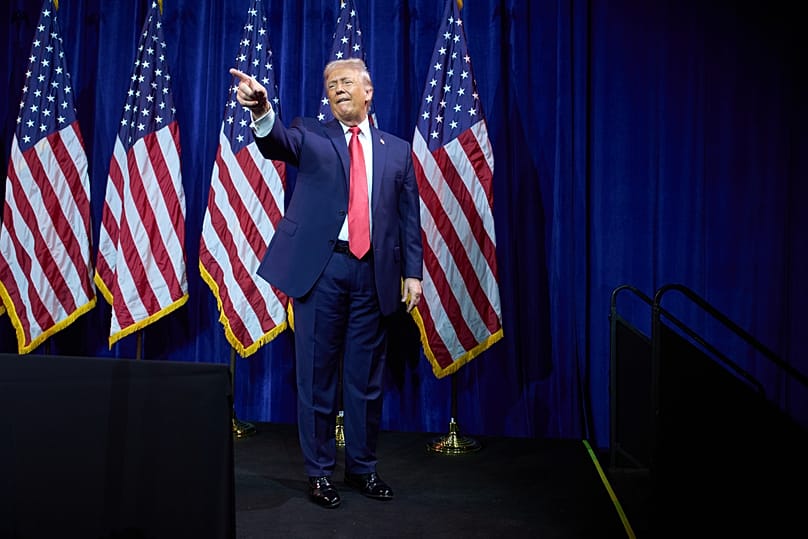 US President Donald Trump points to the crowd as he walks off stage after speaking to Republican lawmakers during their annual policy retreat in Washington, 6 January, 2026