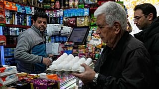 A man shops for eggs at a grocery store in northern Tehran, 6 January, 2026