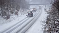 A snow plough cleans the road during a heavy snowfall in Viborg, central Jutland, Denmark, Wednesday Jan. 3, 2024.Temperatures have fallen below minus 40 degrees Celsius in t