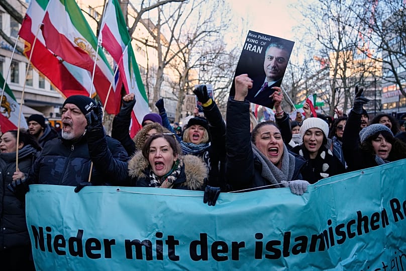 Protesters participate in a demonstration in Berlin, Germany, in support of the nationwide mass protests in Iran against the government, Saturday, Jan. 10, 2026
