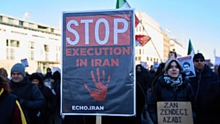 Protesters participate in a demonstration in front of the Brandenburg Gate in Berlin, Germany, in support of the nationwide mass protests in Iran against the government.