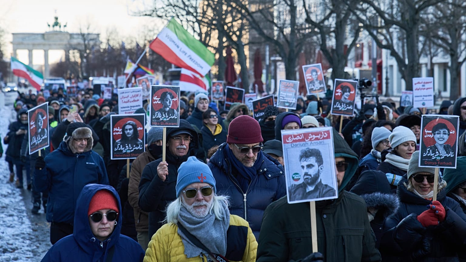 Protesters participate in a demonstration in front of the Brandenburg Gate in Berlin, Germany, in support of the nationwide protests in Iran against, Sunday, January 11, 2026
