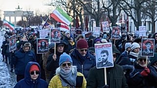 Protesters participate in a demonstration in front of the Brandenburg Gate in Berlin, Germany, in support of the nationwide protests in Iran against, Sunday, January 11, 2026