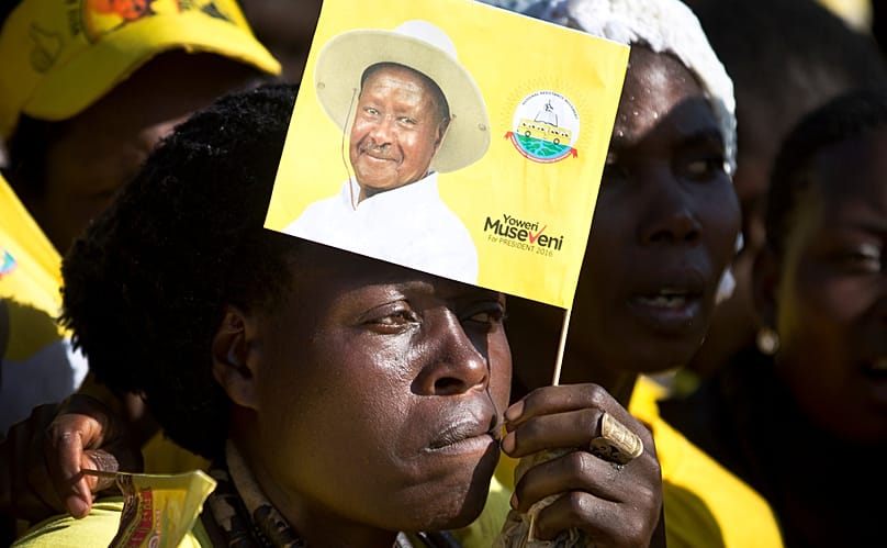 FILE - A supporter holds a flag of Uganda's long-time President Yoweri Museveni at an election rally at Kololo Airstrip in Kampala, Uganda Tuesday, Feb. 16, 2016.