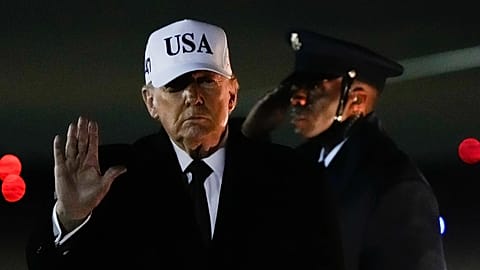 President Donald Trump waves after arriving on Air Force One from Florida, 11 January, 2026