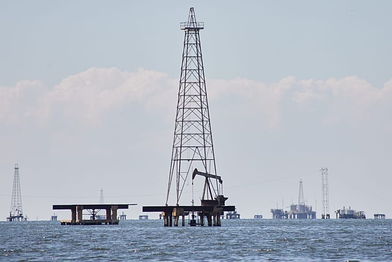 Oil pump jacks stand on Lake Maracaibo Lake in Cabimas, 7 January, 2026