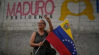 A supporter of former Venezuelan President Nicolás Maduro joins in a rally in Caracas, 10 January, 2026