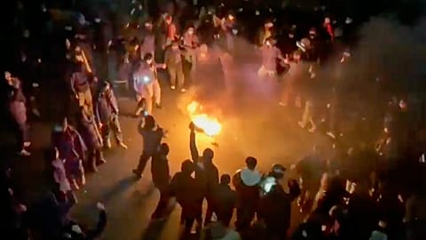 Protesters dancing and cheering around a bonfire as they take to the streets despite an intensifying crackdown in Tehran, 9 January, 2026