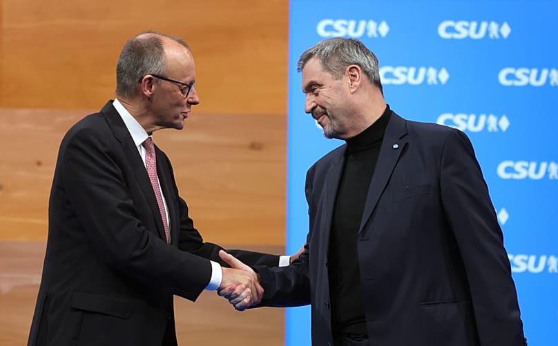 Bundeskanzler Friedrich Merz (CDU) trifft Bayerns Ministerpräsidenten Markus Söder (CSU) bei einer Parteiveranstaltung in München, 13. Dezember 2025
